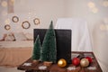 New Year`s interior, decoration of the desktop and bedroom for Christmas. Boke, lights, Christmas trees, balloons, a table with a