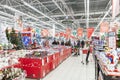 New Year`s interior of a large supermarket. People in masks are shopping for the holiday. Moscow, Russia, 12-17-2021