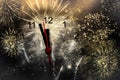 new Year& x27;s at midnight - clock at twelve o& x27;clock with holiday lights and fireworks Royalty Free Stock Photo