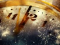 new Year& x27;s at midnight - clock at twelve o& x27;clock with holiday lights and fireworks Royalty Free Stock Photo