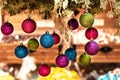 New Year`s multi-colored balls hang from above. Christmas decorations Royalty Free Stock Photo