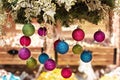 New Year`s multi-colored balls hang from above. Christmas decorations Royalty Free Stock Photo