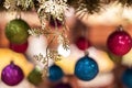 New Year`s multi-colored balls hang from above. Christmas decorations Royalty Free Stock Photo