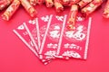 New Year`s red envelopes and firecracker decorations.The Chinese characters in the picture mean `happiness`