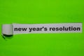 New Year`s Resolution, Inspiration and business concept on green torn paper Royalty Free Stock Photo