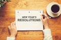 New Year`s Resolutions with a person holding a pen Royalty Free Stock Photo