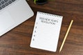 2023 New Year\'s resolutions text on note pad on top of office desk Royalty Free Stock Photo