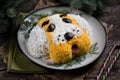 New Year`s Salad `Dog` for the celebration of 2018 - the year of the Yellow Dog. Salad of smoked chicken, boiled potatoes, soft ch Royalty Free Stock Photo