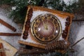 New Year's still-life with hours, snow and fur-tree branches