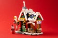 New Year's toy. Winter house of Santa Claus. Lego constructor bricks details. Christmas story and minifigures