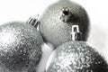 New Year`s toys balls on a Christmas tree on a white and yellow background. Multi-colored balls, decoration. Celebration. Royalty Free Stock Photo
