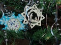 New Year`s toys on branches of a fur-tree. The star of Bethlehem. Five minutes until Christmas. Festive background. Royalty Free Stock Photo