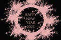 New Year\'s washing year 2023 pink font on a black background.