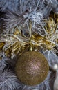 New Year shiny golden ball on the tree. Background.