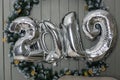 2019 new year - silfer foil ballon in wooden background