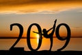 2019 New Year Silhouette of Girl Dancing at Golden Sunset Royalty Free Stock Photo