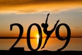 2019 New Year Silhouette of Girl Dancing at Golden Sunset Royalty Free Stock Photo