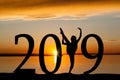 2019 New Year Silhouette of Girl Dancing at Golden Sunset Royalty Free Stock Photo