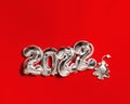 New Year 2022 silver balloons number and decorations form as Christmas tree and silver star on red fabric background
