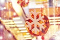 New Year snowflake on a shiny ball on a background of colorful Christmas lights Royalty Free Stock Photo