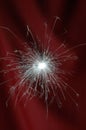 New Year Sparkler on a dark red backdrop Royalty Free Stock Photo