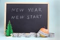 New year, new start lettering on the blackboard with chalk. Motivational quote for New Year 2021 resolution. Slimming concept Royalty Free Stock Photo