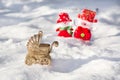 New Year stroller with a newborn on a background of a pair of happy snowmen.