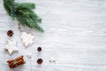 New year symbols. Spruce branch, cones and toys for decoration like spruce and stras on grey background top view space