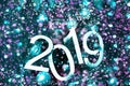 New year 2019 text on colorful background, christmas tree, decoration and lights, holiday concept backdrop Royalty Free Stock Photo