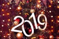 New year 2019 text on colorful background, christmas tree, decoration and lights, holiday concept backdrop Royalty Free Stock Photo
