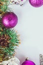 New year theme: Christmas tree purple and silver decorations, balls on white retro wood background