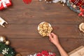 New Year. Person taking cookies from plate isolated on table top view close-up Royalty Free Stock Photo