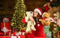 New year tips and ideas. happy girl at xmas party. christmas shopping sales. happy santa woman bear toy present. at the