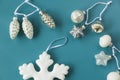 New year toys, christmas tree toys, white and gray toys on the blue background Royalty Free Stock Photo