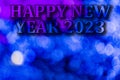 New Year 2023. Translucent numbers of the year on a blue-toned background of bright lights out of focus. Horizontal design. Royalty Free Stock Photo
