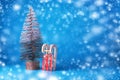 New Year tree and small wooden sled on a blue background. Copy space. Place for text. Christmas, New Year background. Royalty Free Stock Photo