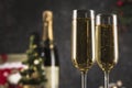 New year 2021 - two glasses of champagne on a dark background with bokeh from garlands Royalty Free Stock Photo