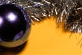 New Year violet bubble with silver tinsel on a background