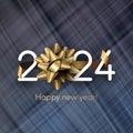 New Year 2024 white paper numbers with golden foil bow and ribbon placed on textured mesh cloth dark background Royalty Free Stock Photo