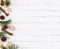 New year white wooden background with fir tree, cones and natural christmas decorations on left side Royalty Free Stock Photo