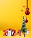 New year winter yellow background with 3d gift box and red 2024 letters