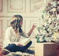 New Year Woman Portrait near Christmas Tree with gift boxes Royalty Free Stock Photo