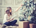 New Year Woman Portrait near Christmas Tree with gift boxes Royalty Free Stock Photo