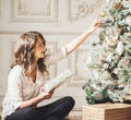 New Year Woman Portrait near Christmas Tree with gift boxes Royalty Free Stock Photo