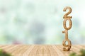 New year 2019 wood number 3d rendering on wooden plank table a Royalty Free Stock Photo