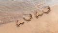 New Year 2020 written on sand beach and ocean wave. lettering on the beach. Happy New Year 2020. letters on sea bye year 2021 Royalty Free Stock Photo