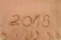 New Year written on sandy beach 2018 is coming like date holiday concept Royalty Free Stock Photo