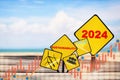 New year 2024 written on yellow sign with growth graph Royalty Free Stock Photo