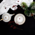 New Year's composition. New Year and Christmas. A spruce branch, a cup and a kettle on a red background Royalty Free Stock Photo