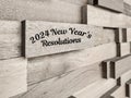 2024 New Year's Resolutions with wooden blocks background. New year concept.